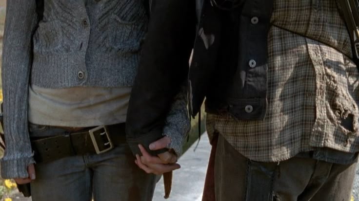 Beth and Daryl from The Walking Dead holding hands